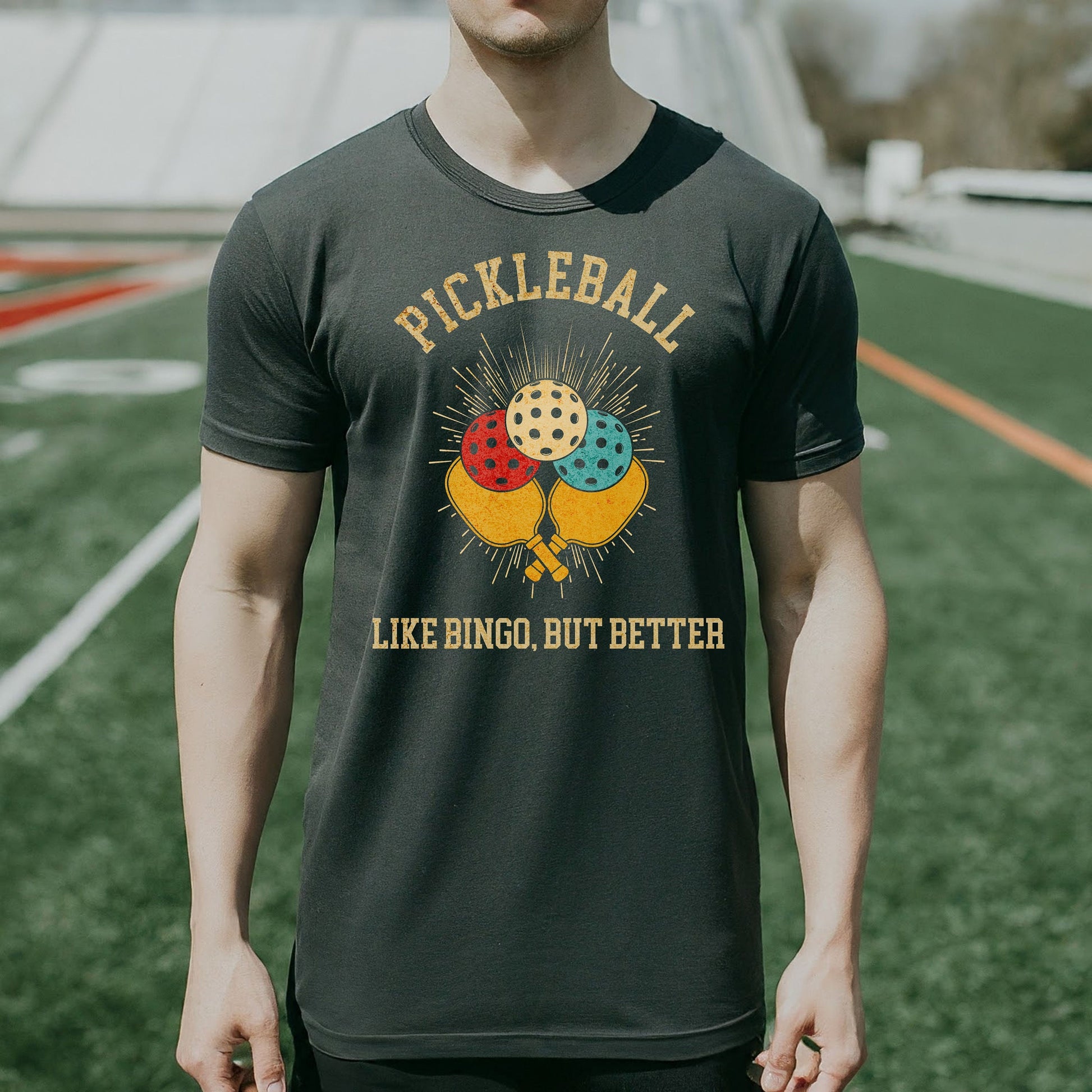 a man standing on a field holding a frisbee