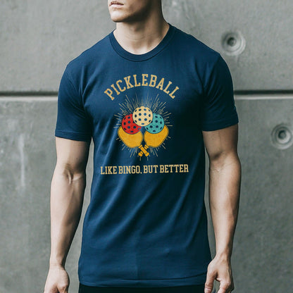 a man wearing a pickleball t - shirt standing in front of a wall