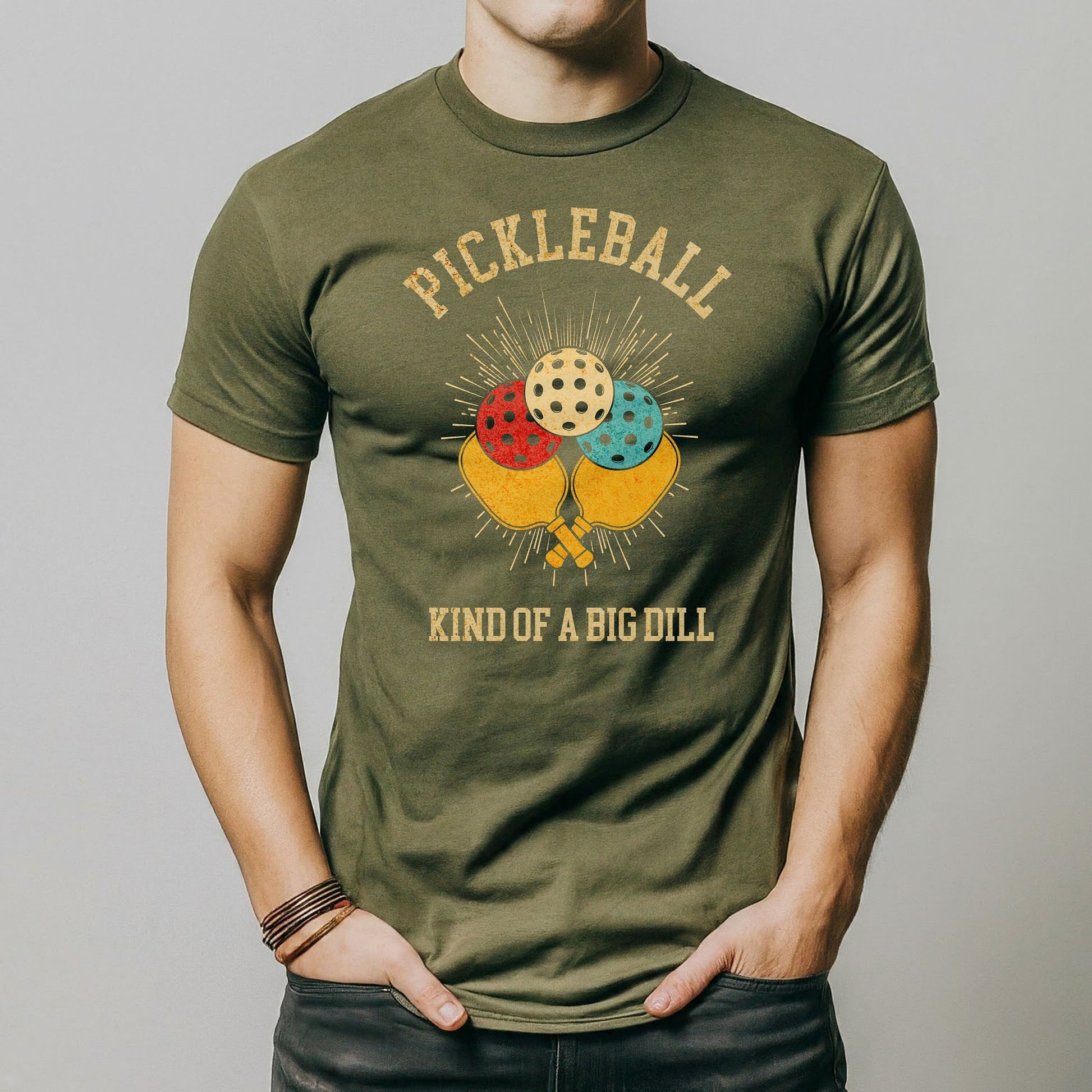a man is wearing a pickleball t - shirt