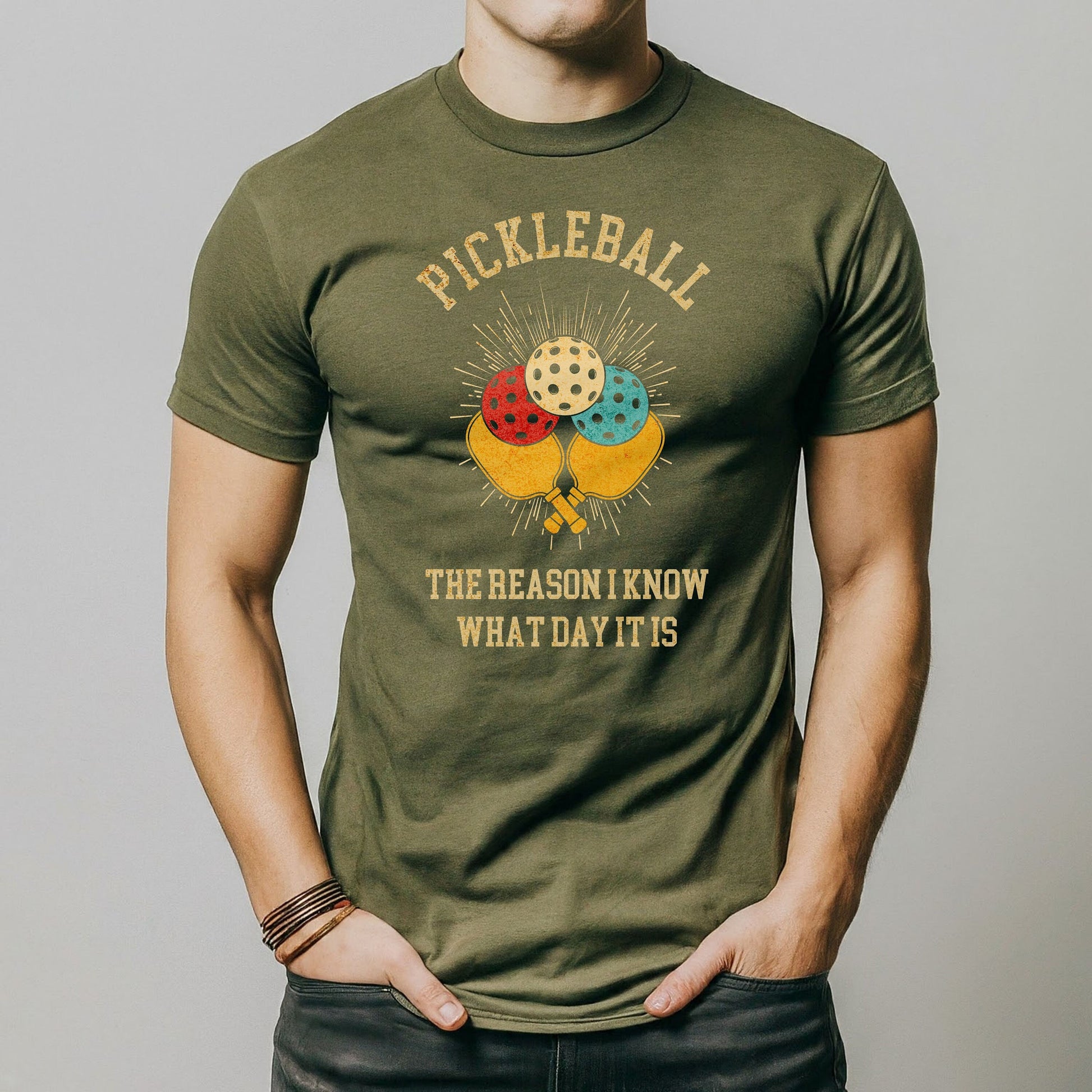 a man is wearing a pickleball t - shirt