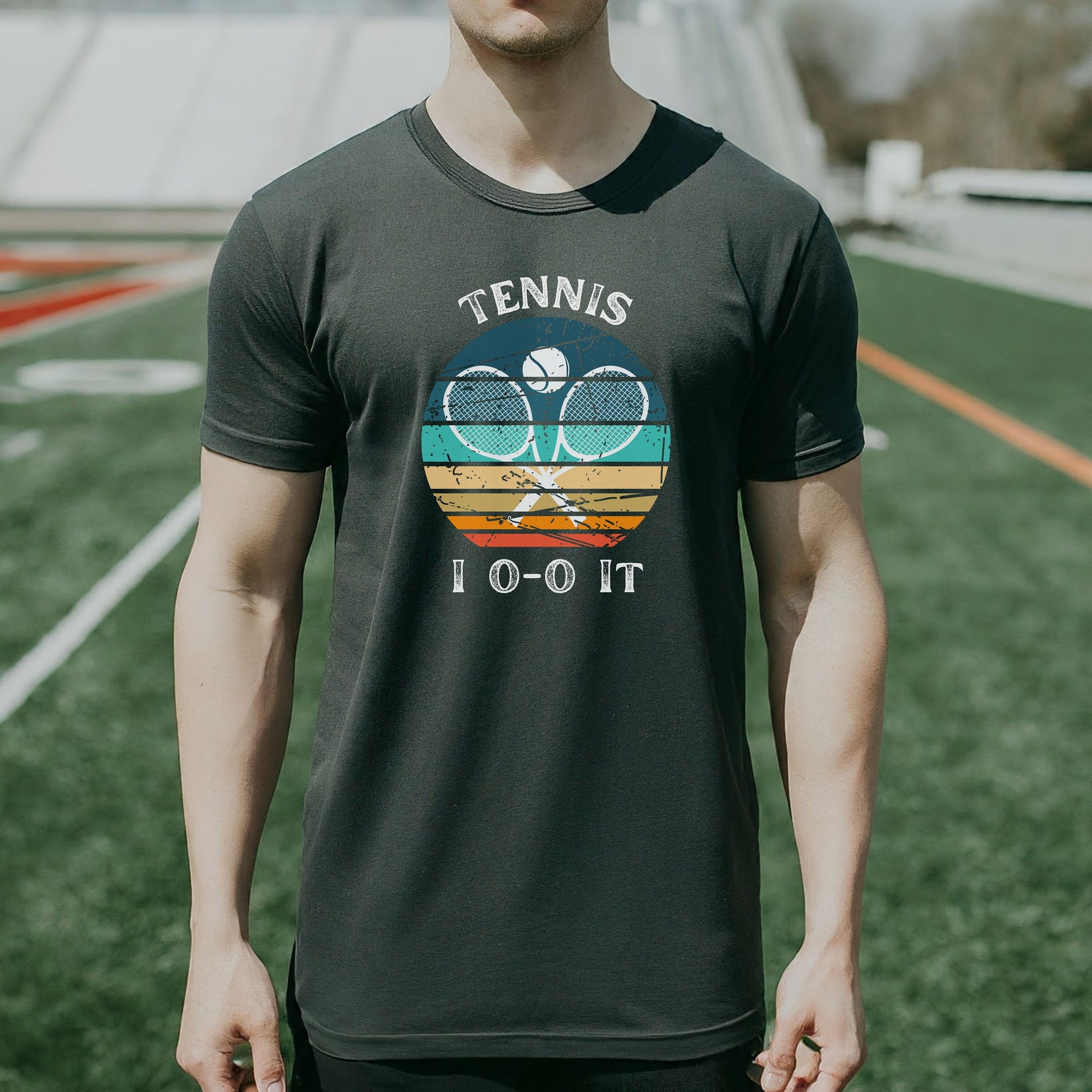 a man standing on a field with a tennis racket
