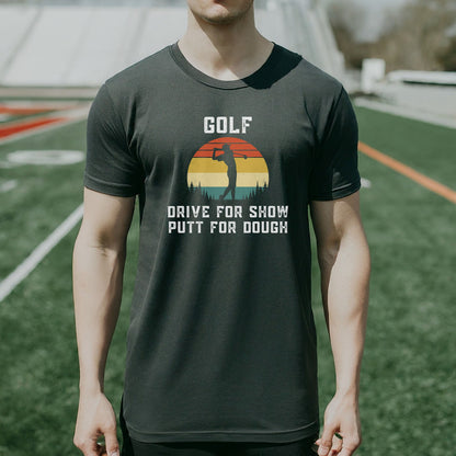 a man standing on a field wearing a golf shirt