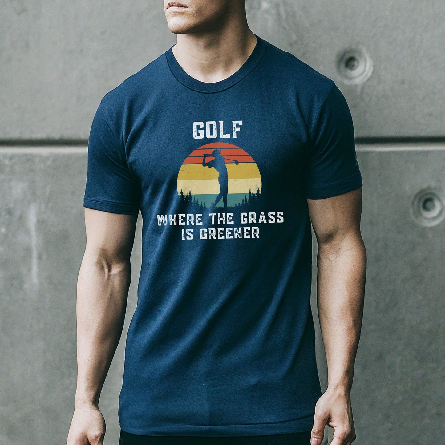 a man wearing a blue golf t - shirt with the words where the grass is