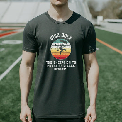 a man standing on a field wearing a disc golf shirt