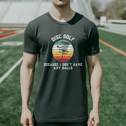 a man standing on a field wearing a disc golf t - shirt