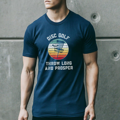 a man wearing a disc golf t - shirt standing in front of a wall