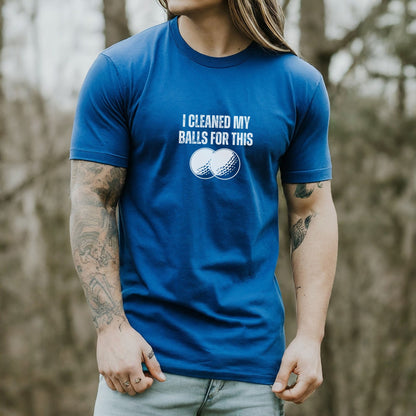 a man with long hair wearing a blue shirt