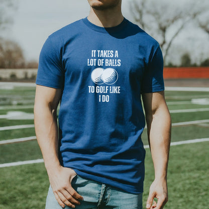 a man standing on a field wearing a blue shirt