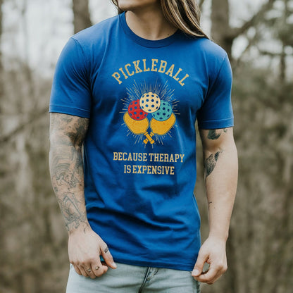 a man with long hair wearing a blue pickleball t - shirt