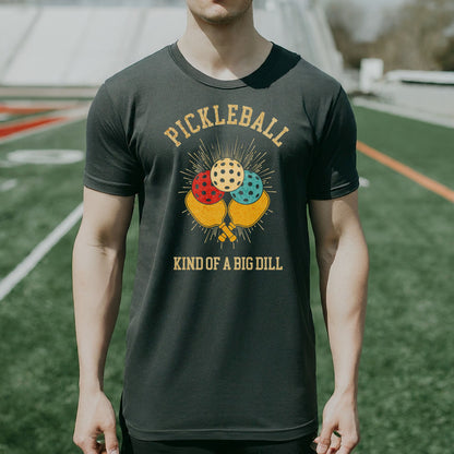 a man wearing a pickleball kind of a big dilll t - shirt