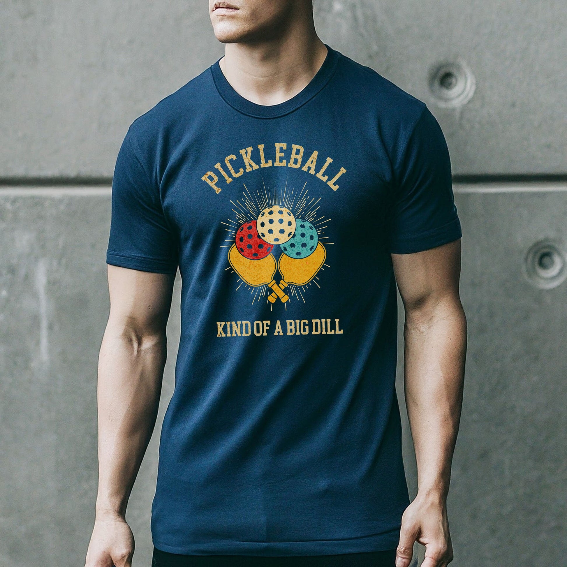 a man wearing a pickleball kind of a big dill t - shirt