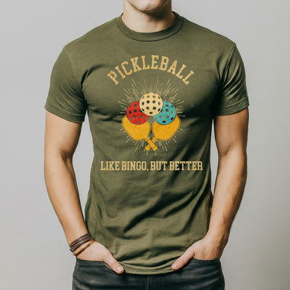 a man wearing a green pickleball t - shirt