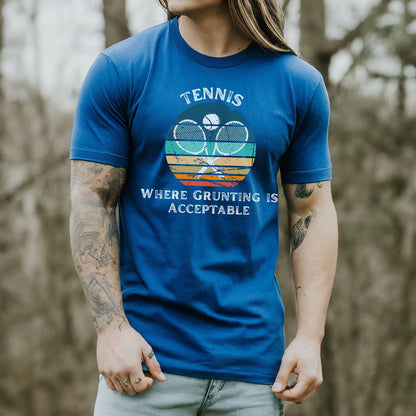 a man with long hair wearing a blue tennis shirt