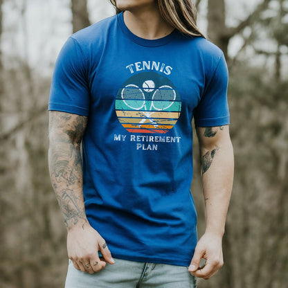 a man with long hair wearing a blue tennis shirt