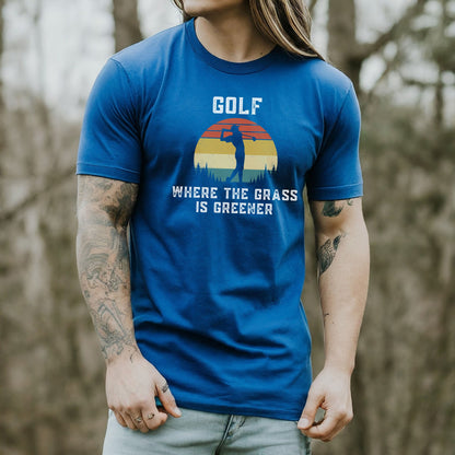 a man with long hair wearing a blue golf shirt