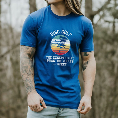 a man with long hair wearing a blue disc golf t - shirt