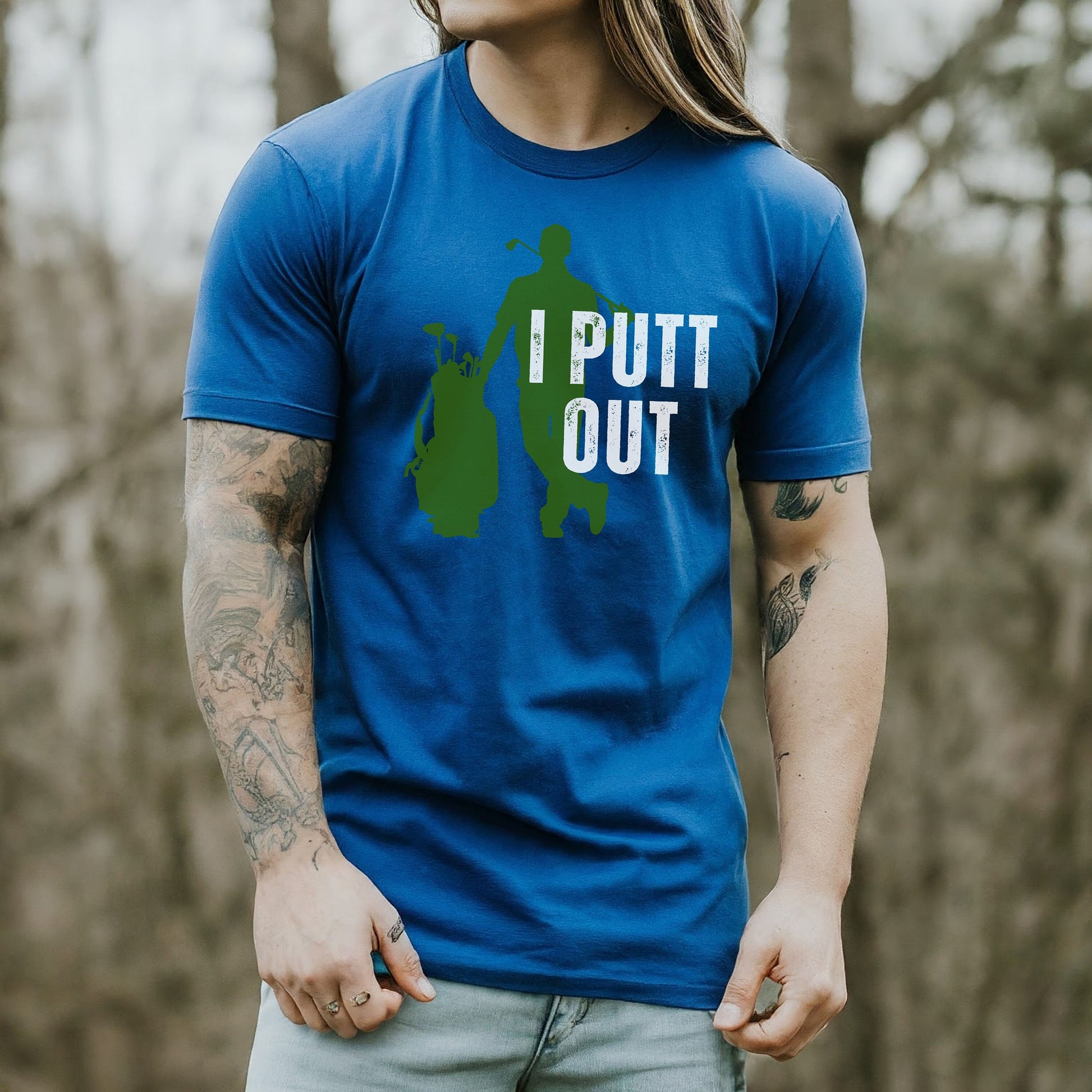 a man with long hair wearing a blue shirt that says i put out