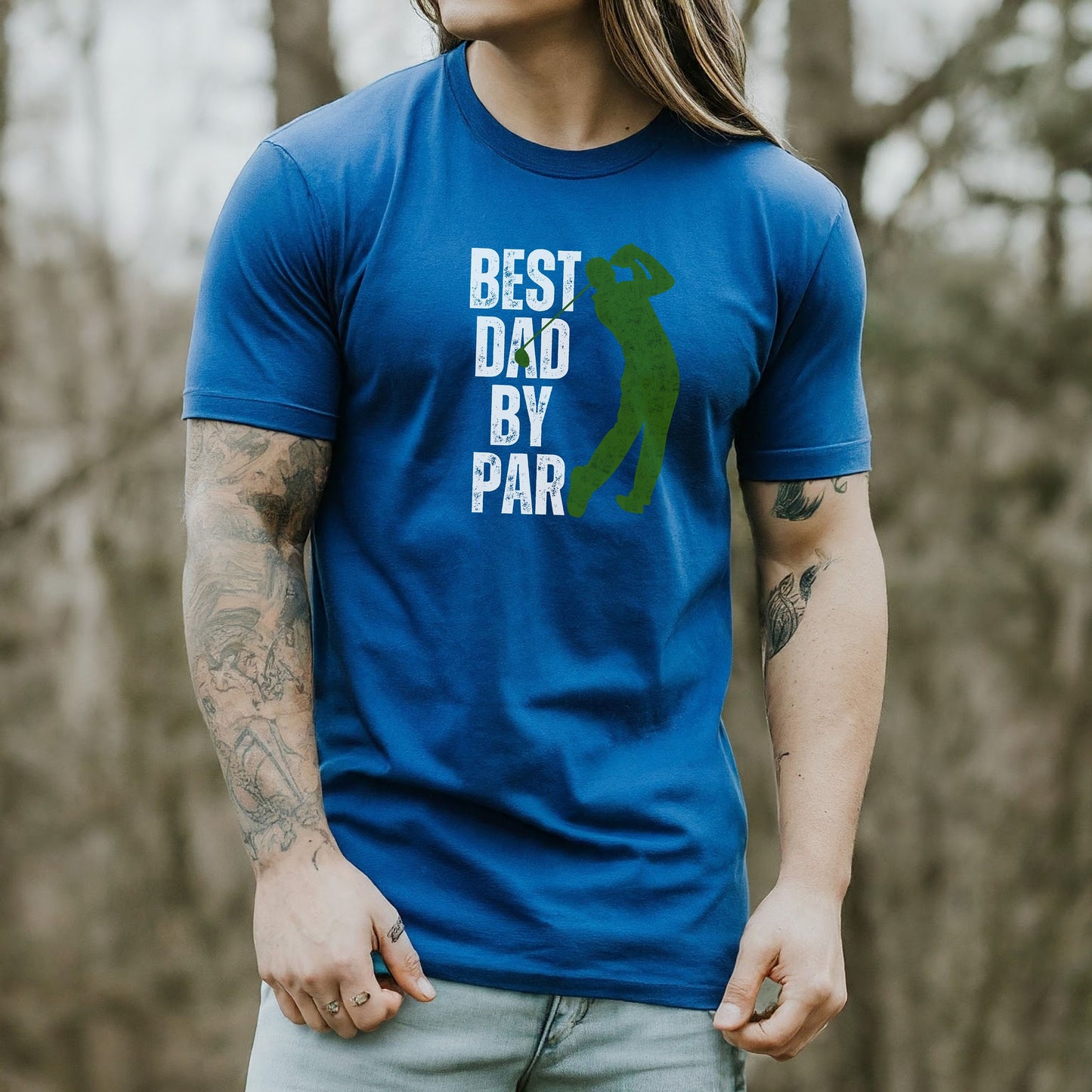 a man with long hair wearing a blue shirt with the words best dad by par