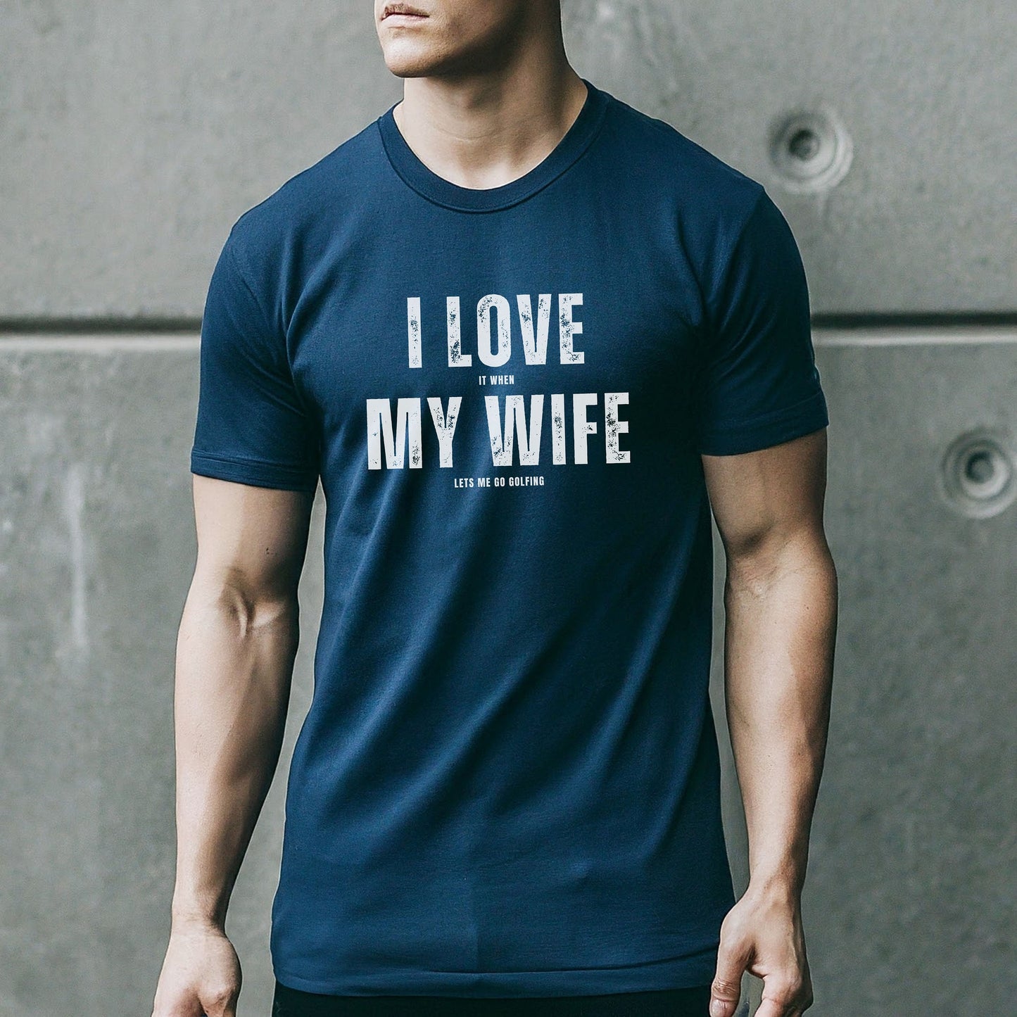 a man wearing a t - shirt that says i love my wife