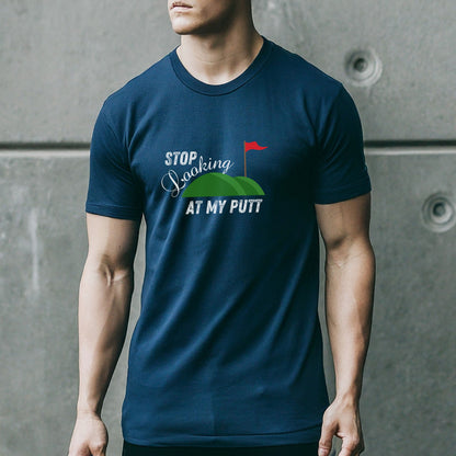 a man in a blue shirt is holding a skateboard