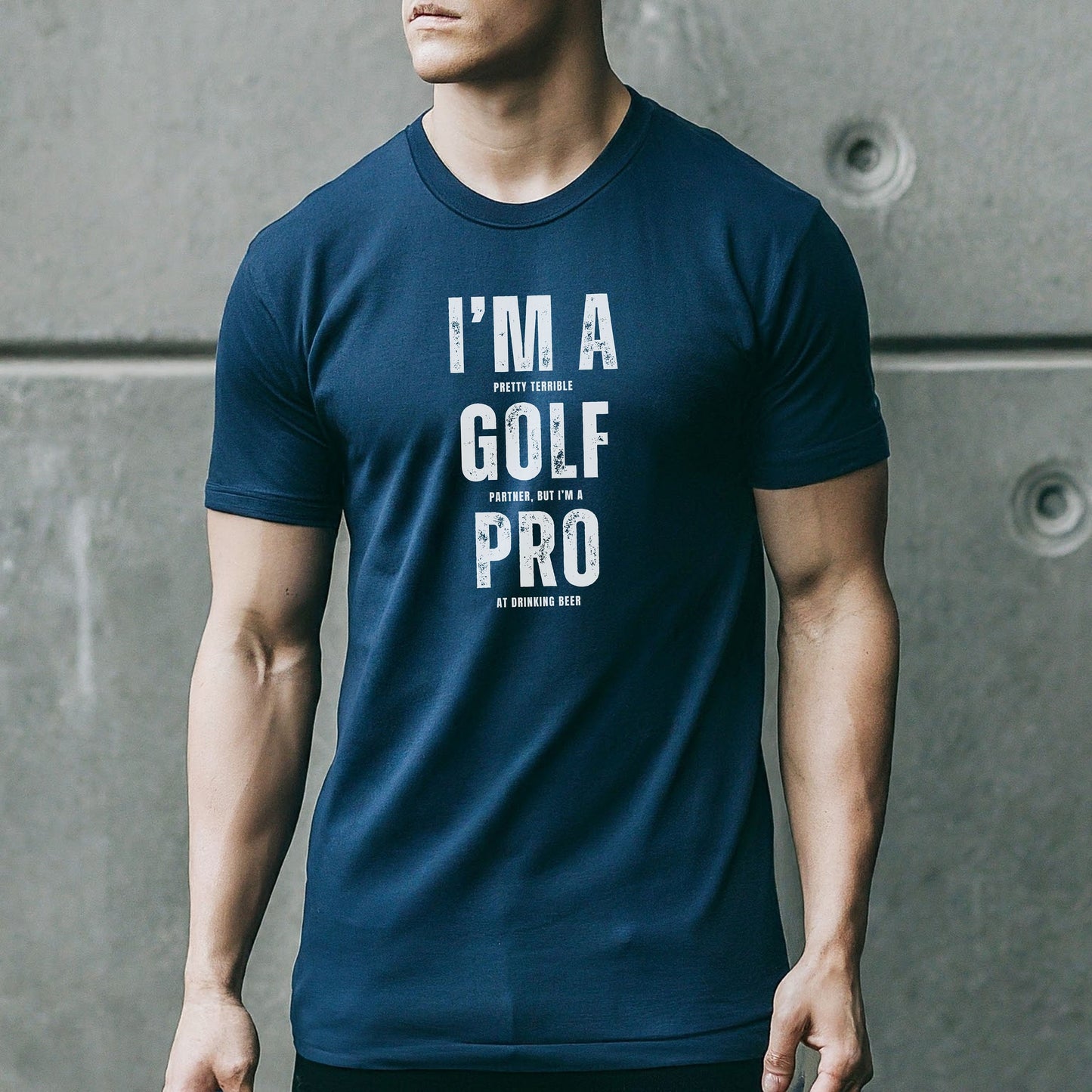 a man wearing a t - shirt that says i'm a golf pro