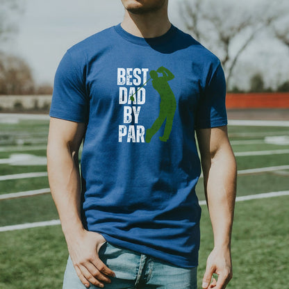 a man standing on a field wearing a blue shirt