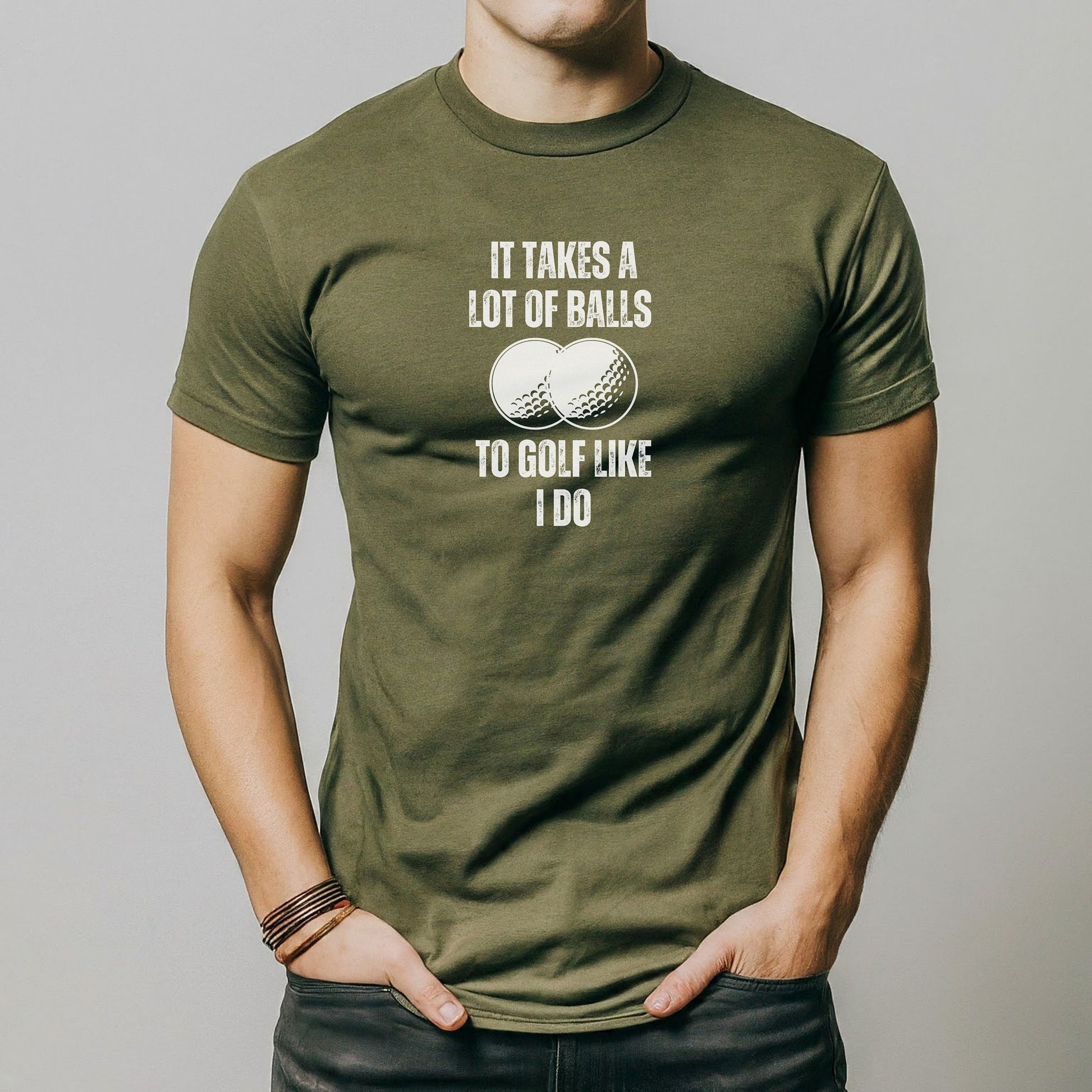 a man wearing a t - shirt that says it takes a lot of balls to