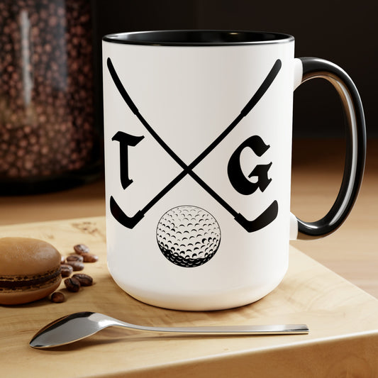 a coffee mug with a golf ball and crossed golf clubs on it