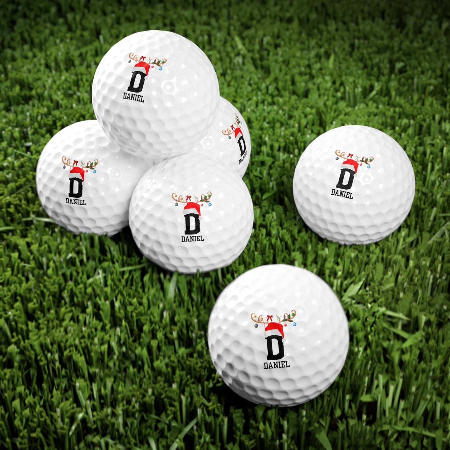 a group of golf balls sitting on top of a lush green field