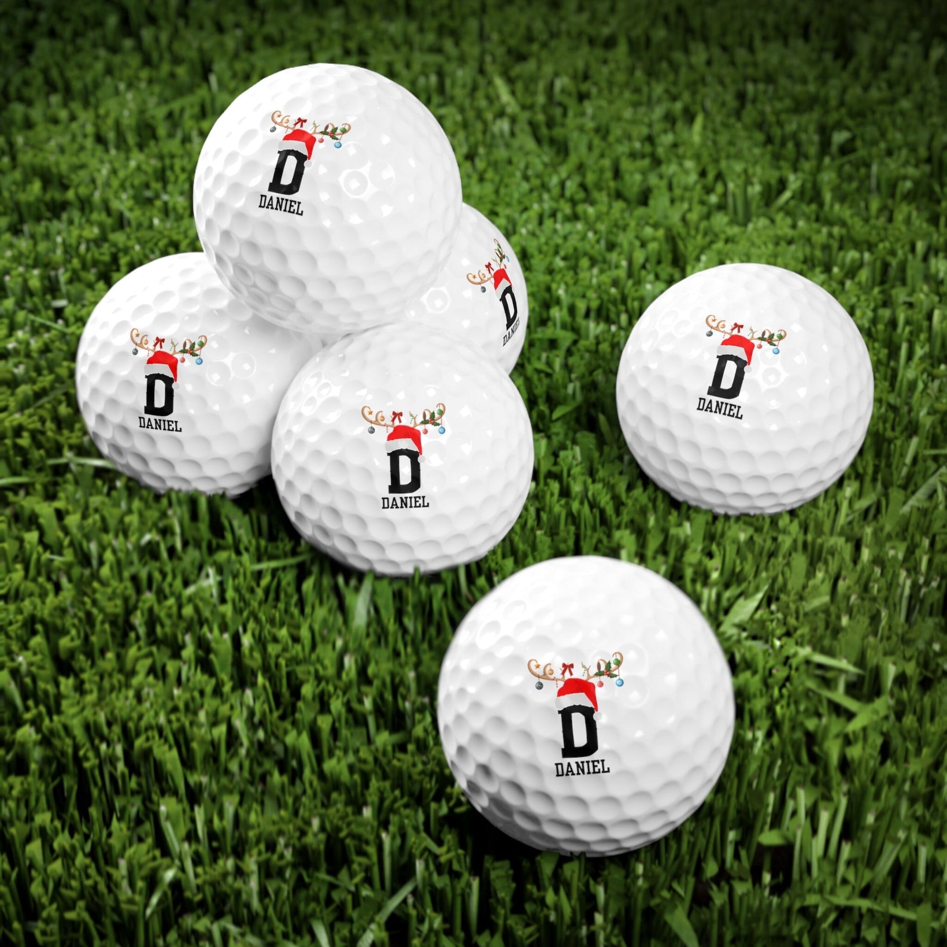 a group of golf balls sitting on top of a lush green field