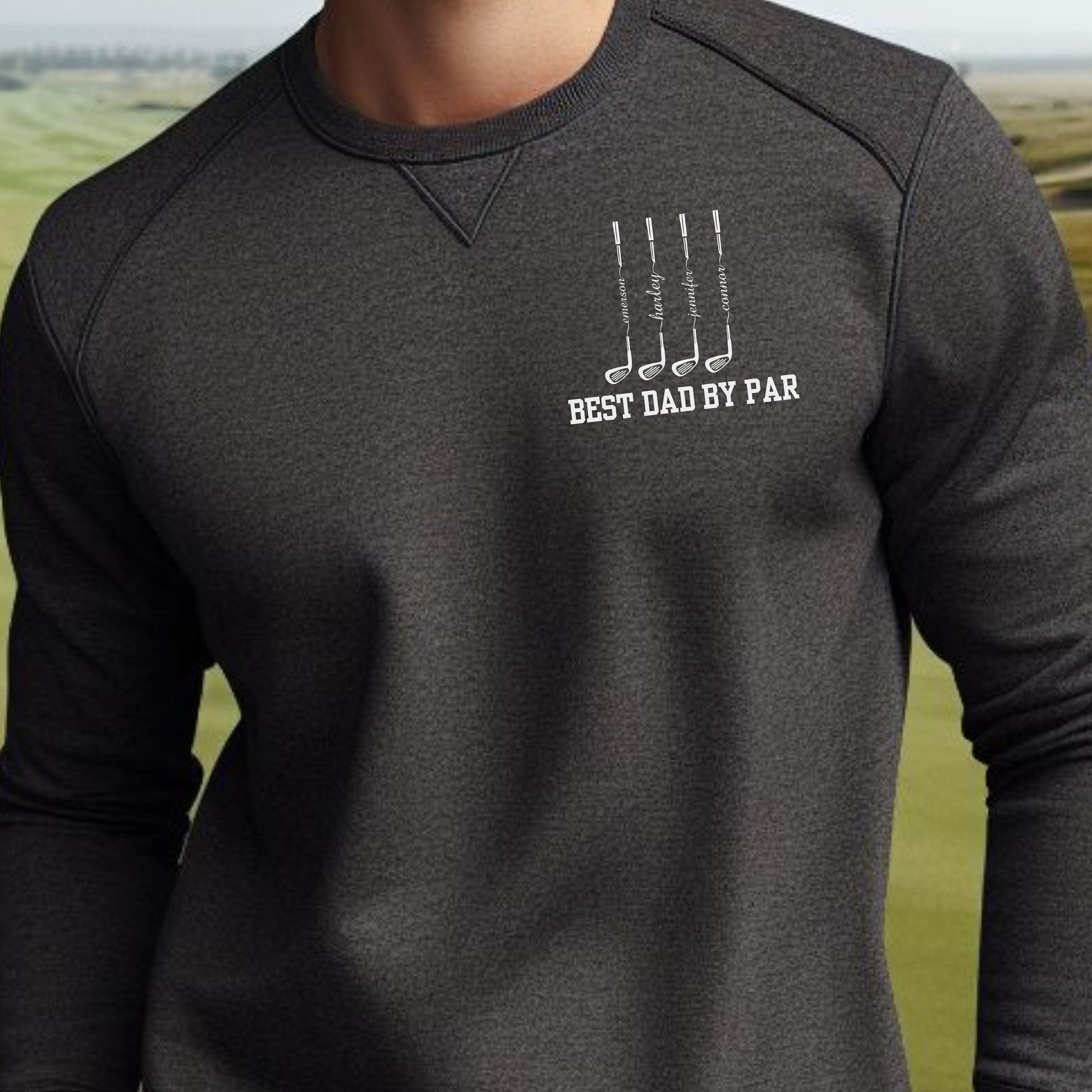 a man in a black shirt is standing in a field